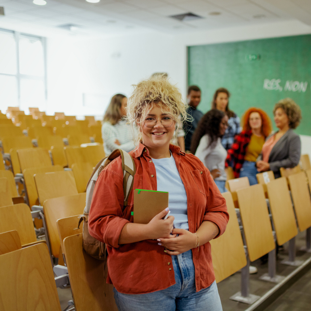 Blonde female student in class room