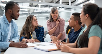 Mature staff and students in discussion DFC