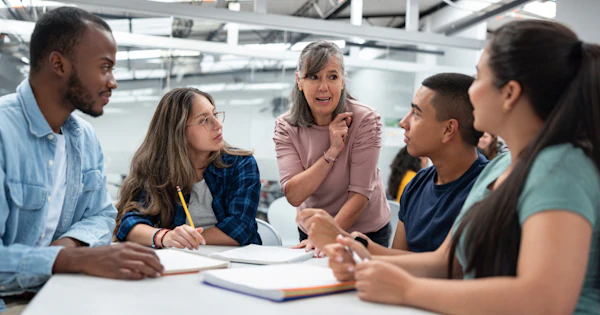 Mature staff and students in discussion DFC