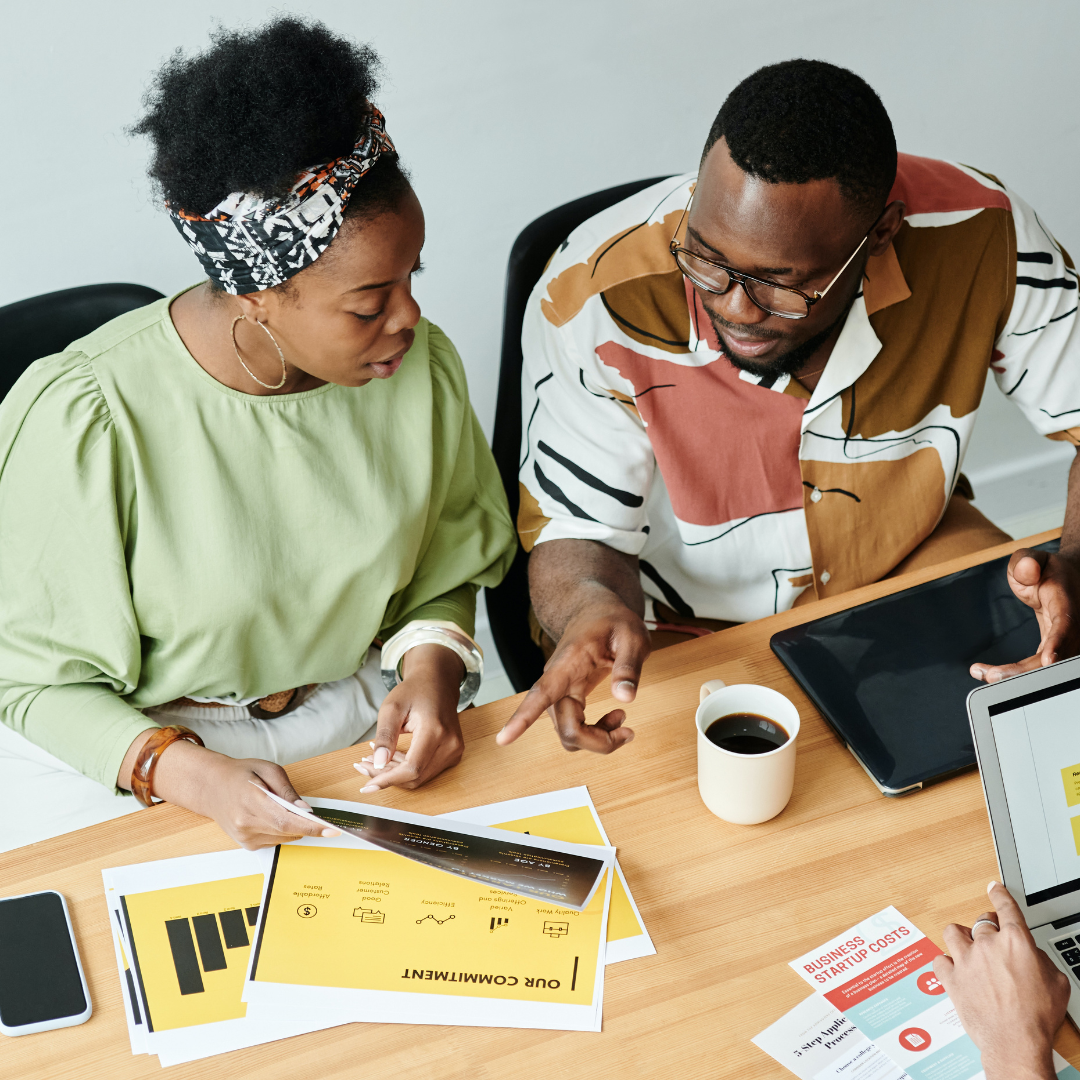 Staff members sitting at table
