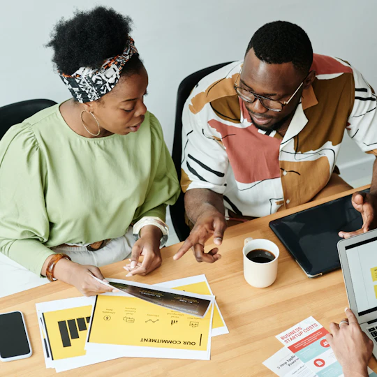Staff members sitting at table